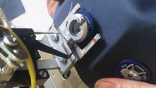 Ready-made automated solution for sewing on a rubber label on the Brother KE-430