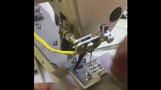 Automated solution for sewing on a metal hanger
