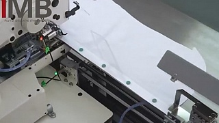 Automated solution for sewing on buttons to a shirt IMB MB 6006A